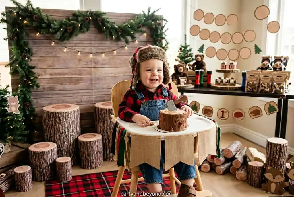 Rustic lumberjack birthday with buffalo check tablecloth and wood decor