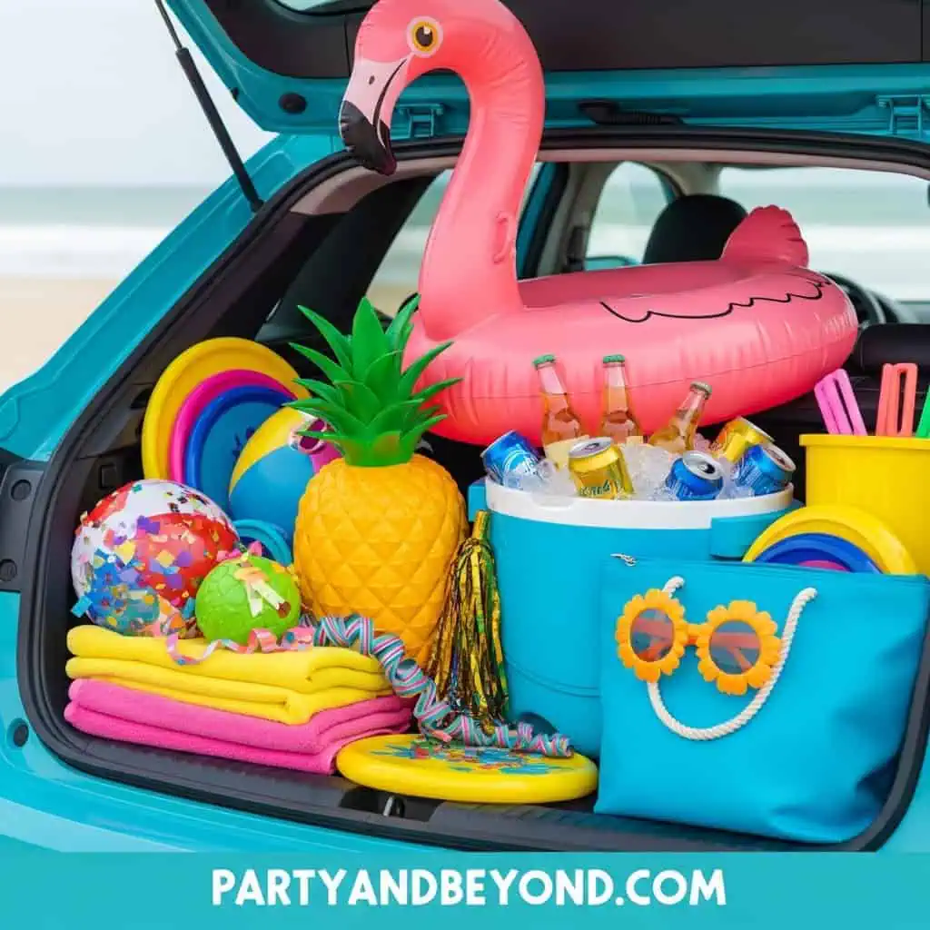 Bright summer pool party supplies with inflatable flamingo, pineapple, and colorful accessories.