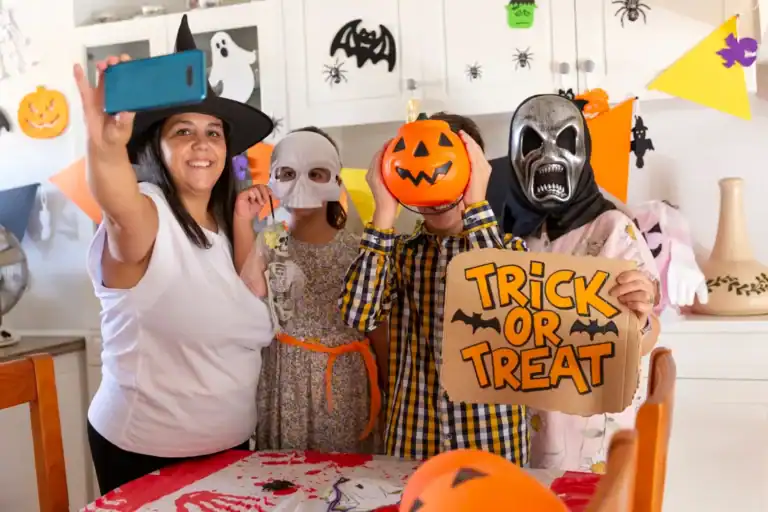 Group of adults in Halloween costumes playing Minute to Win It games for Halloween fun.