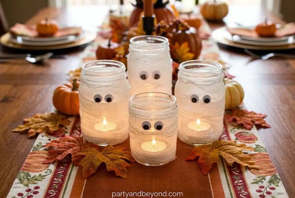 Cute mummy candle holders wrapped in gauze with googly eyes