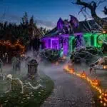 16 Scary Good Halloween Outdoor Decoration Ideas Halloween haunted house with spooky skeletons, glowing pumpkins, and eerie lighting for a festive pa.