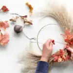 19 Simple And Easy Fall Crafts to Make and Sell for Profit Autumn fall wreath making with dried leaves and flowers for seasonal decor. Perfect for fall craft p.