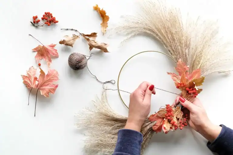 Autumn fall wreath making with dried leaves and flowers for seasonal decor. Perfect for fall craft p.