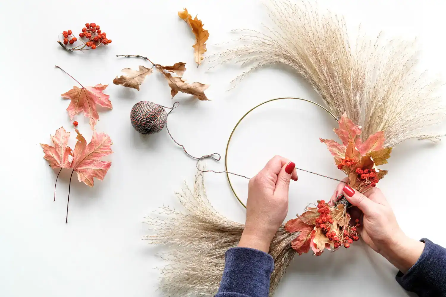 Autumn fall wreath making with dried leaves and flowers for seasonal decor. Perfect for fall craft p.