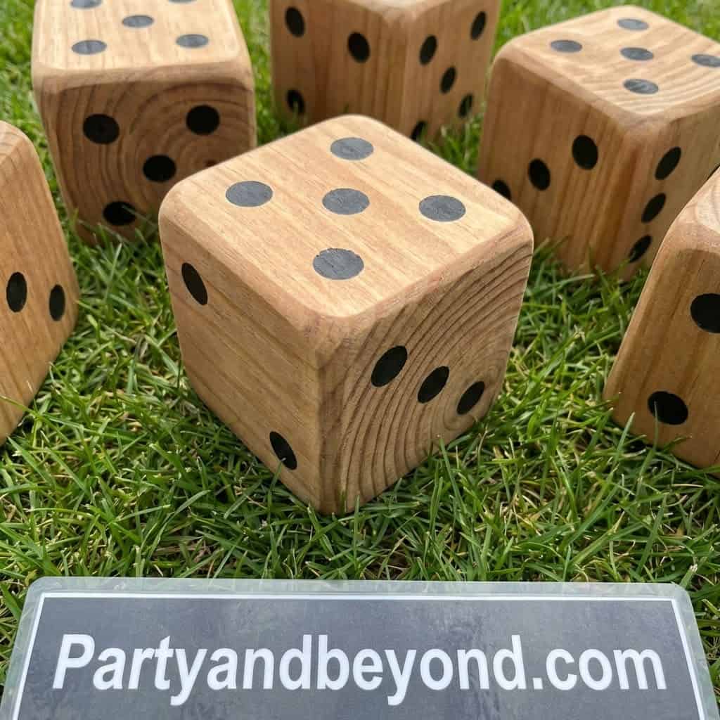 Colorful wooden dice for outdoor summer BBQ games and entertainment.