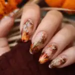 41 Gorgeous Fall Nail Design Ideas to Try This Season Beautiful fall-inspired nail art with orange and gold accents.