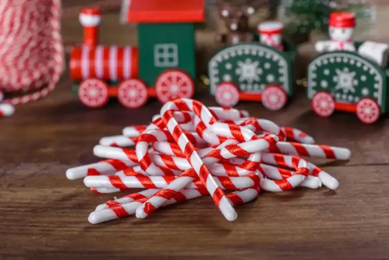 Colorful candy cane straws perfect for holiday party games and decorations.