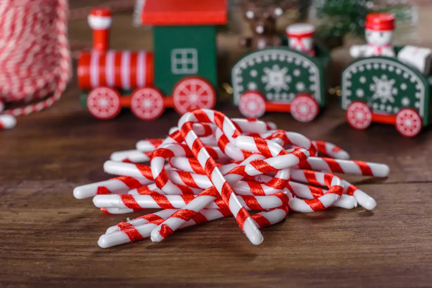 Colorful candy cane straws perfect for holiday party games and decorations.