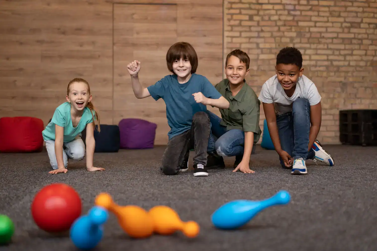 Kids playing Minute to Win It games at school.