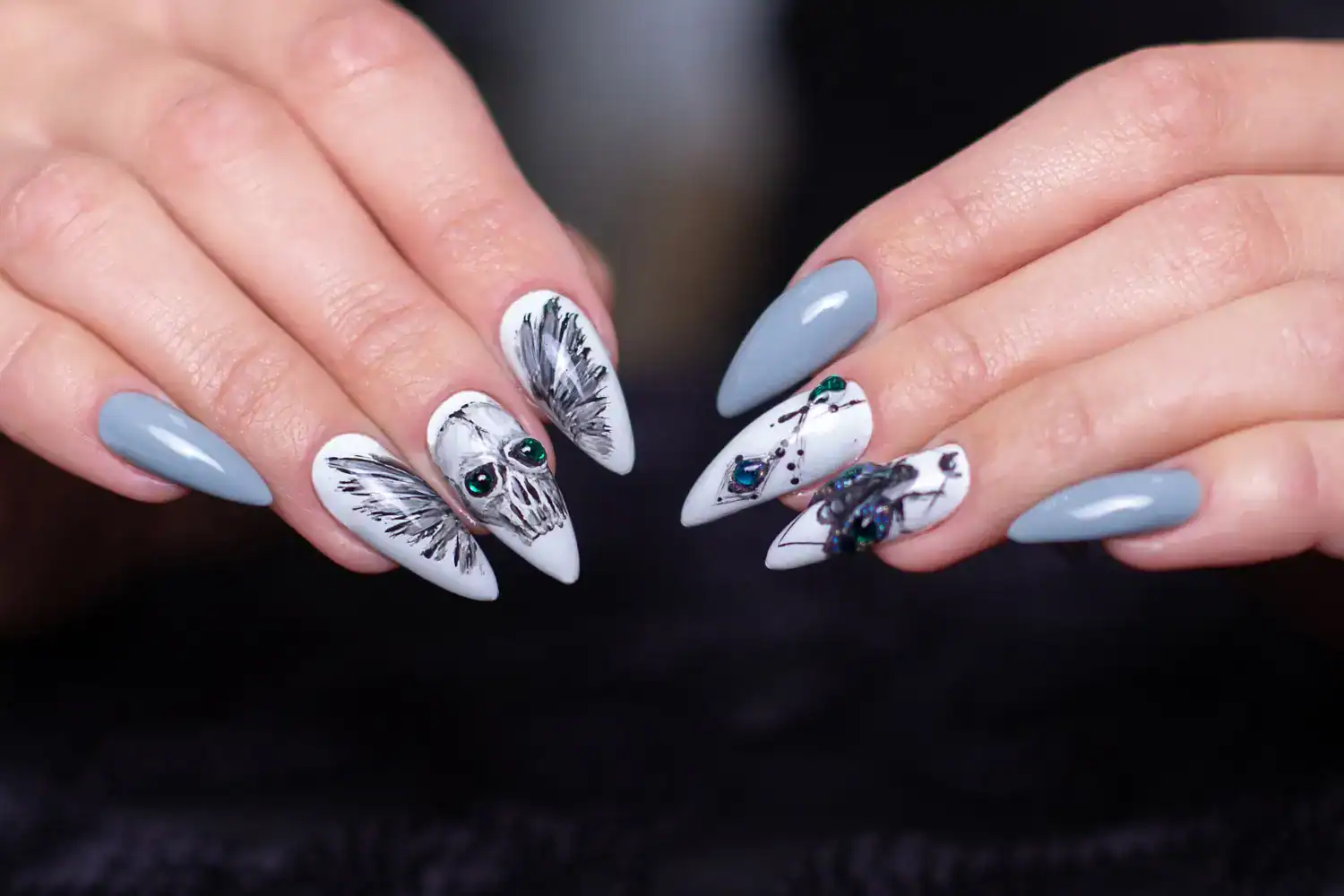 Halloween skull nail design with spooky black and white details for horror-themed nails.