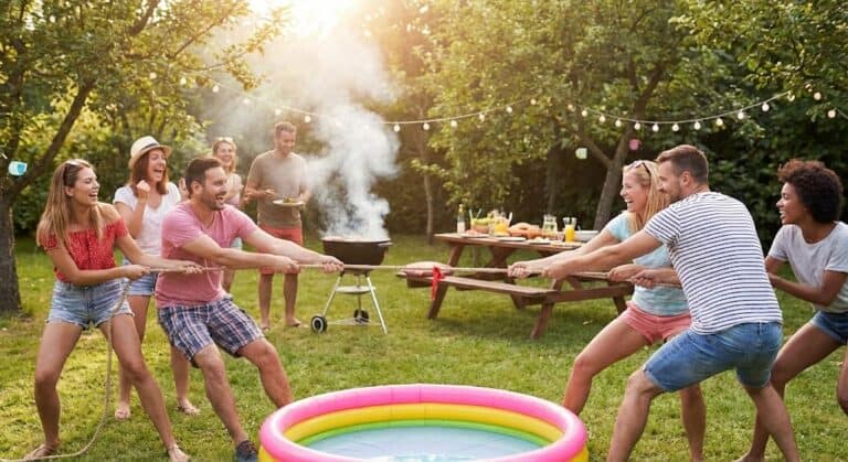 Outdoor summer BBQ game with friends, featuring tug-of-war and a kiddie pool.