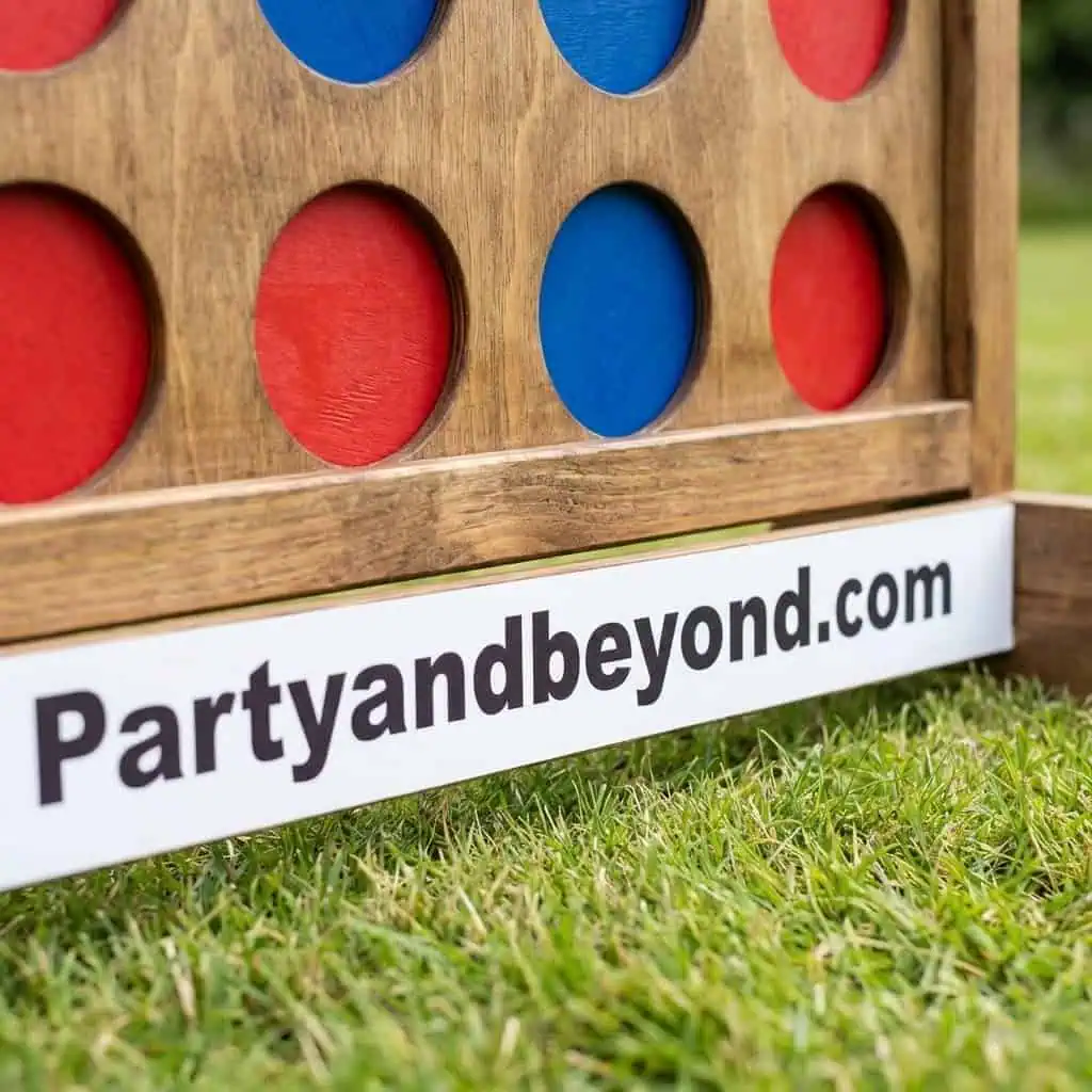Outdoor giant connect four game for summer BBQ fun.
