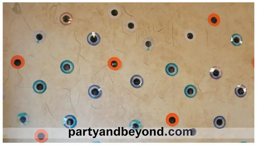 Fun Halloween googly-eye wall backdrop with oversized and miniature eyes