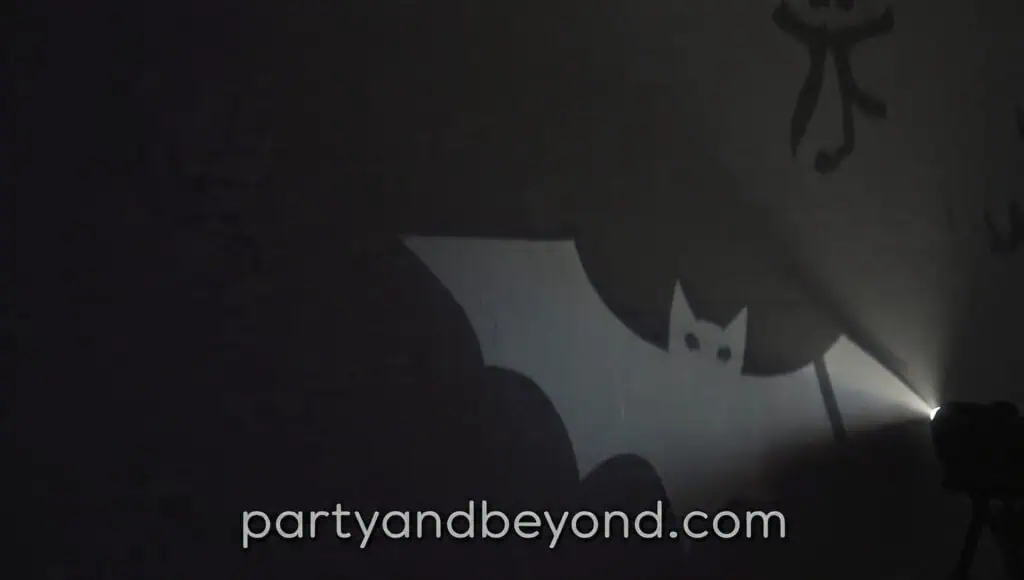 Halloween wall projection displaying moving bats and ghosts for a party backdrop