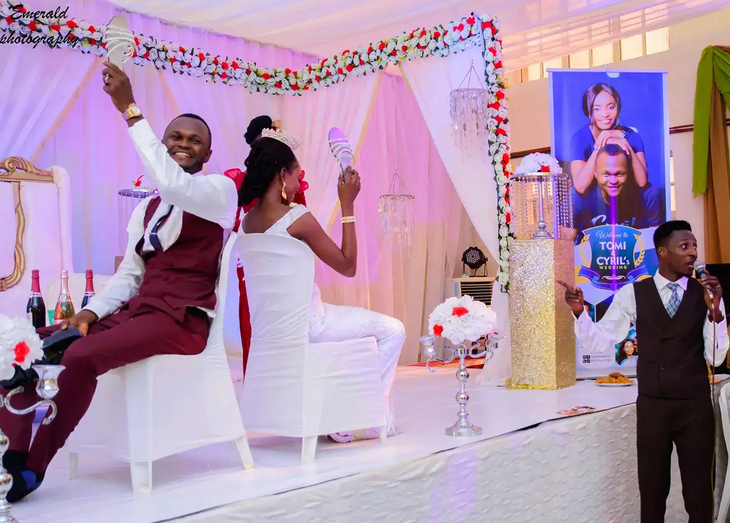 Wedding shoe game with happy bride and groom on stage.