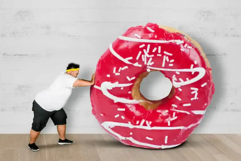 Large pink donut prop for party games.