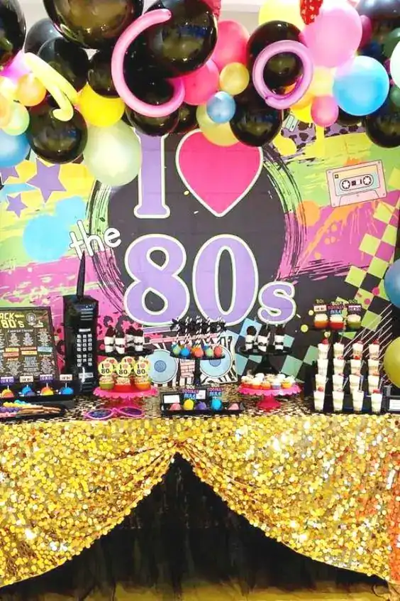 Colorful 80s themed birthday party setup with balloons and retro decorations.