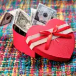 26 Cool Creative Money Gift Ideas for Teens Heart-shaped gift box with cash inside, perfect for teen gift ideas.