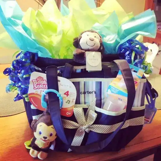 Baby shower gift basket with plush toys, diapers, and accessories for new moms.