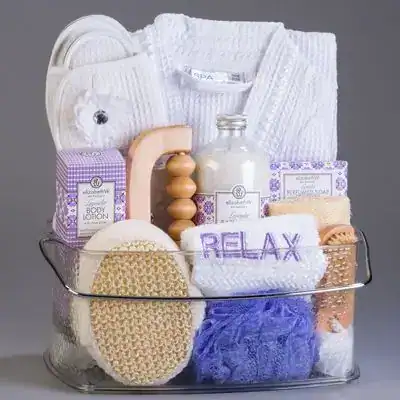 Baby shower gift basket with spa essentials for new moms, including towels, lotion, and relaxation a.
