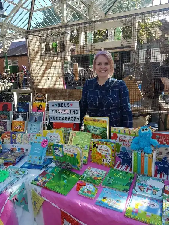 Book fair fundraiser booth with children's books and toys at Party & Beyond!.