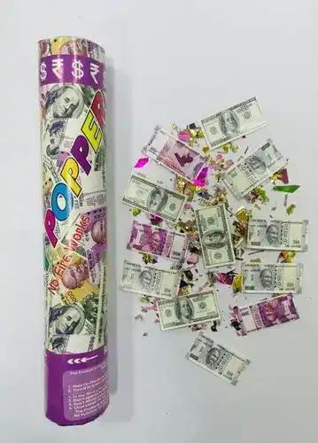 Confetti popper filled with rolled dollar bills and confetti as a festive money gift for teens