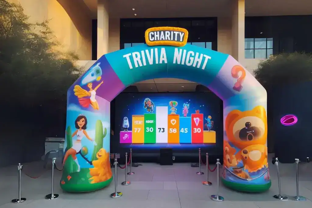 Inflatable arch for charity trivia night event with colorful design and game setup.