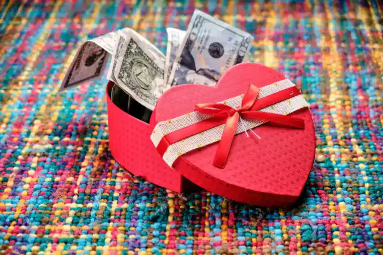 Heart-shaped gift box with cash inside, perfect for teen gift ideas.