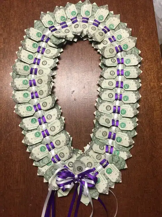 Garland of small envelopes filled with cash and personal notes, strung on twine as a teen birthday gift creative money gift ideas for teens