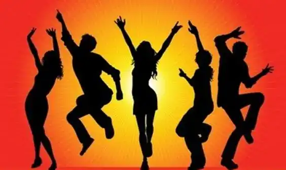Group of teens dancing and having fun at a party with vibrant sunset background.