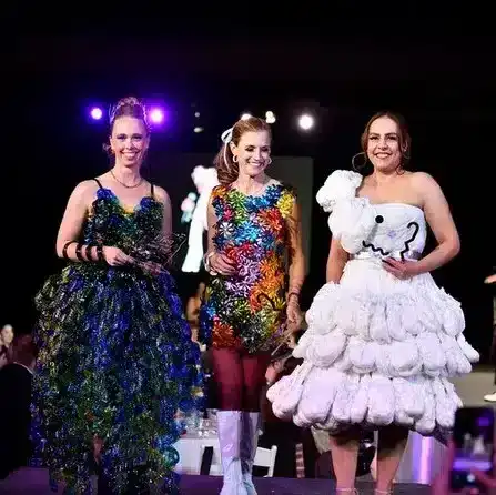 Vibrant teens at a fundraising event wearing colorful and creative costumes.