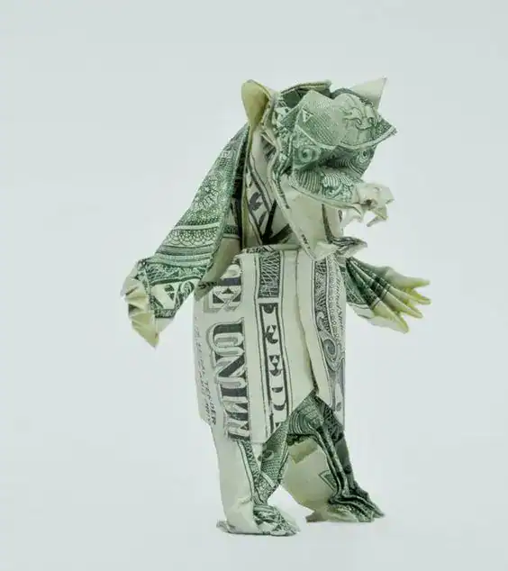 Origami piggy bank made from dollar bills, perfect for teen money gifts and savings.