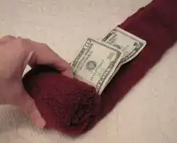 Fun novelty socks stuffed with rolled dollar bills as a humorous and creative teen money gift
