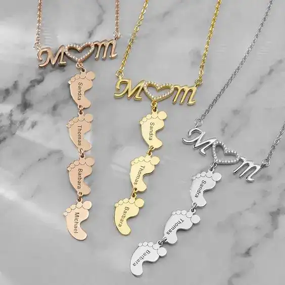Customizable mom necklace featuring name charms of family members, perfect for baby shower gift idea.