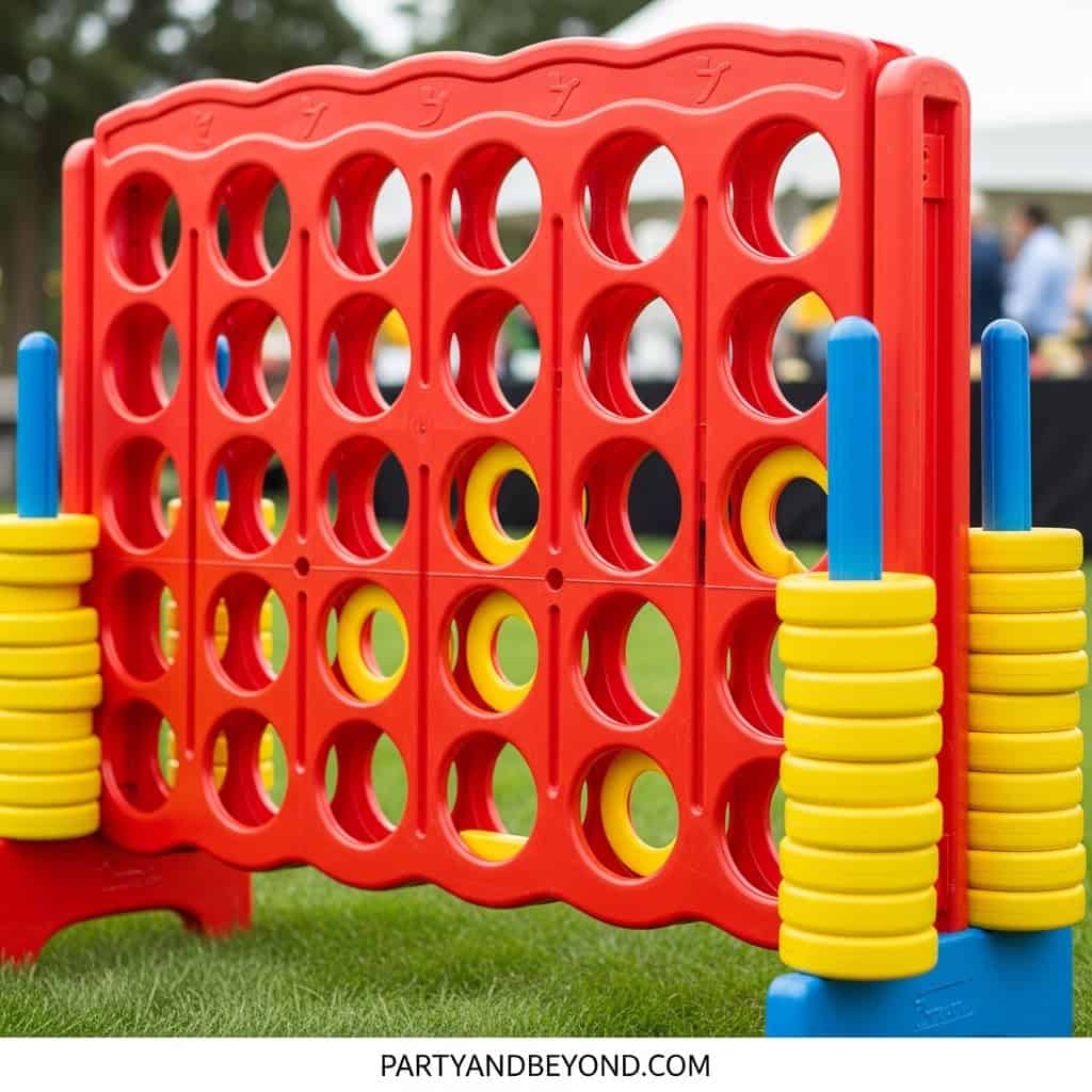 Large red outdoor connect four game for wedding lawn entertainment and party games.
