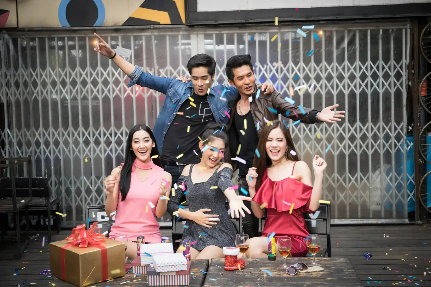 Vibrant teen girl birthday celebration with friends and colorful decorations.