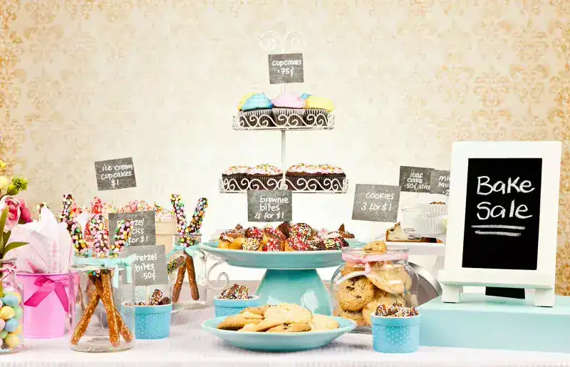 Bake Sale Dessert Table with Cookies and Cupcakes.