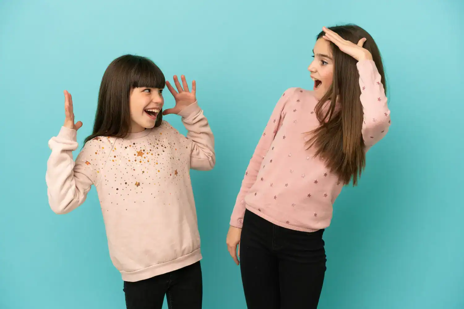 Two girls celebrating Twin Day in fun outfits for Spirit Week.