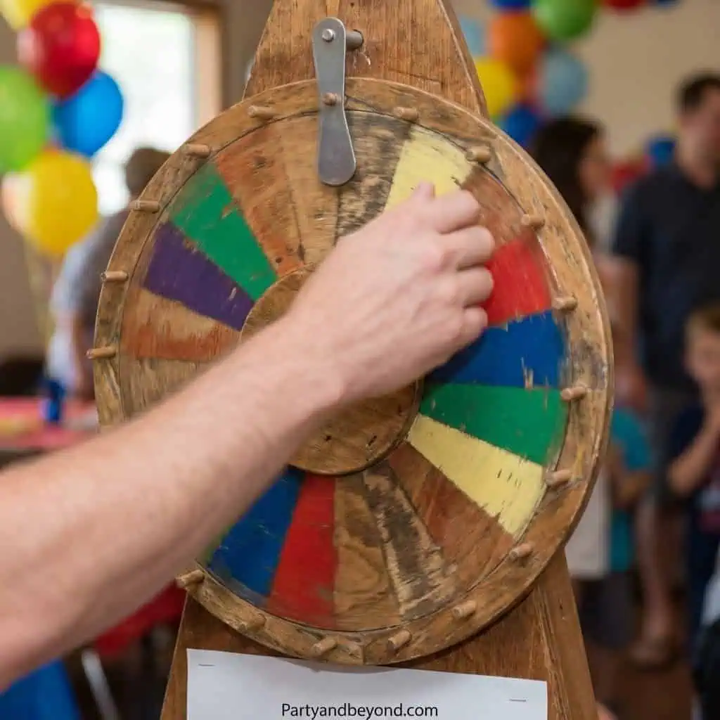Interactive spinning wheel game at a lively party.