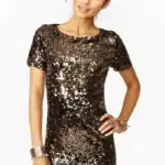 23 New Year's Outfit Ideas for Teens Glamorous teen New Year's outfit with a sparkling sequin dress. Perfect for celebrating the New Year.
