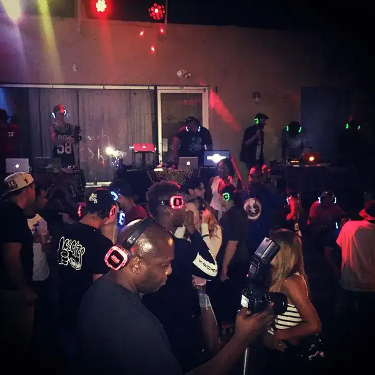 Students dancing with wireless headphones at a silent disco end-of-year school party
