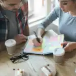 70+ Exciting New Year Bucket List Ideas for Couples Couple planning New Year bucket list ideas together.