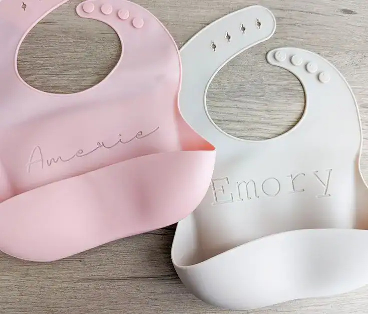Personalized baby bibs with names for first tooth celebration, soft silicone, and adorable design.