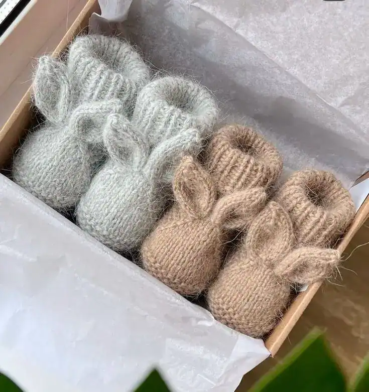 Adorable baby booties with bunny ears in neutral tones, perfect for first tooth or milestone gifts.
