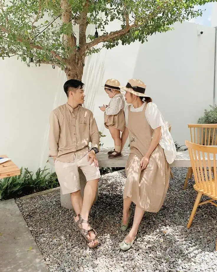 Cute family enjoying a first tooth celebration outdoors.
