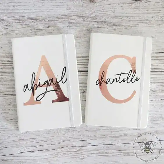 Personalized notebook favors for housewarming parties.