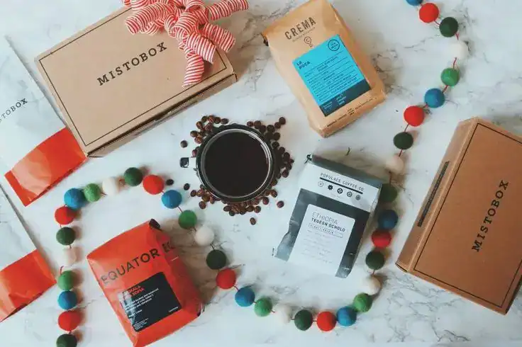 Elegant coffee gift set with beans and accessories for housewarming.