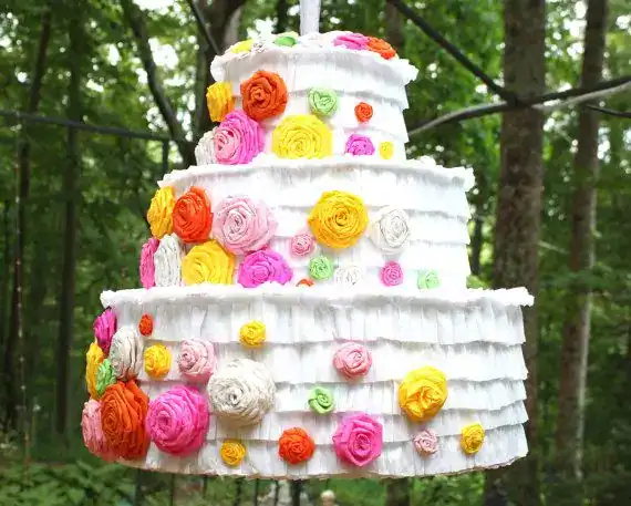 Piñata surprise cake with a hollow candy-filled center that spills out when cut, perfect for birthday parties