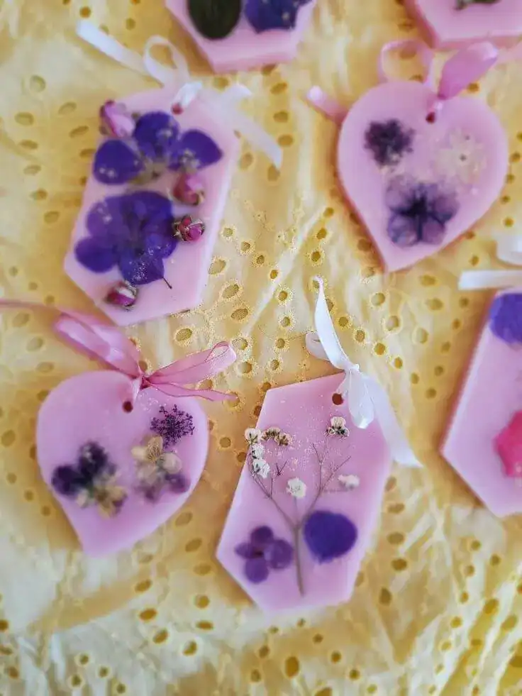 Decorative floral wax melts with dried flowers and ribbons.