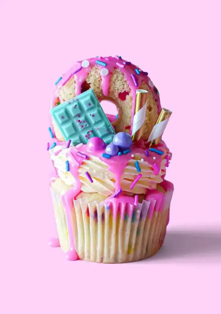 Pull-apart cupcake cake arranged in a shape with coordinating frosting colors for a birthday party